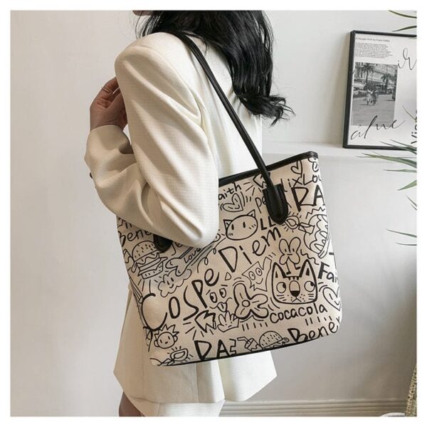 Printed canvas graffiti tote bag with doll - Image 3